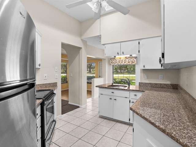 kitchen with white cabinetry, appliances with stainless steel finishes, sink, and ceiling fan