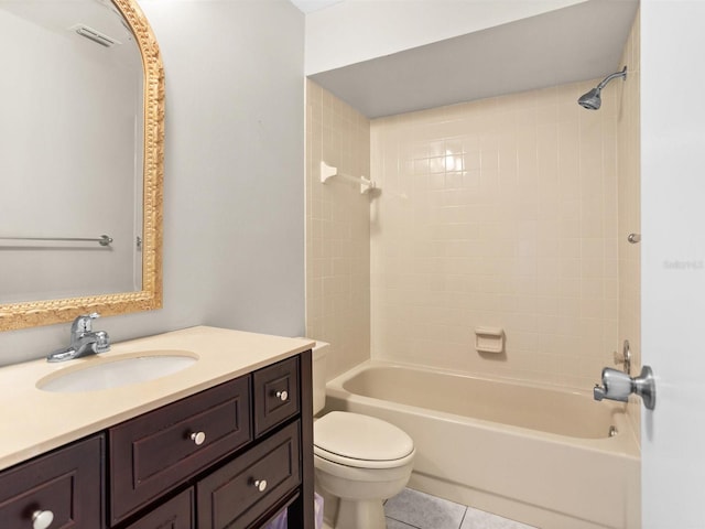 full bath featuring toilet, shower / tub combination, vanity, and tile patterned floors