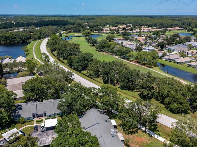 birds eye view of property featuring a water view and a residential view