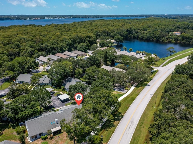 bird's eye view featuring a water view, a residential view, and a view of trees