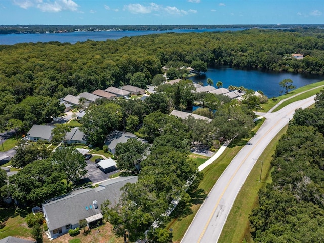 bird's eye view featuring a residential view, a water view, and a view of trees