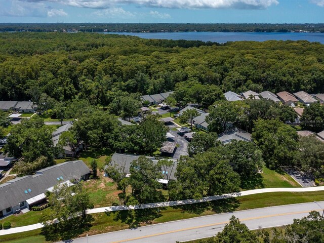 aerial view featuring a residential view, a water view, and a forest view