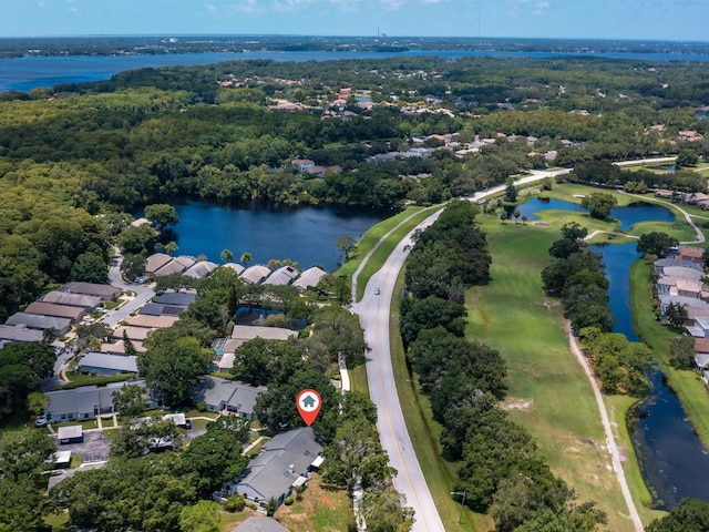 bird's eye view featuring a residential view, a water view, and a view of trees