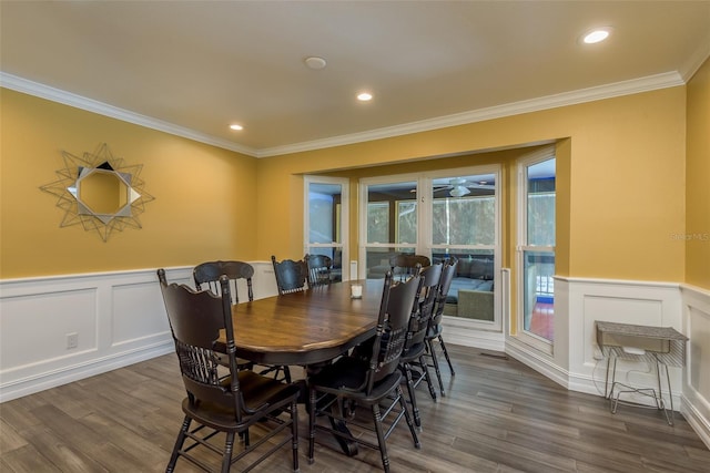 dining area with dark wood-type flooring and ornamental molding