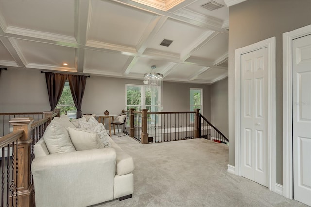 living room with beam ceiling, carpet, a chandelier, ornamental molding, and coffered ceiling