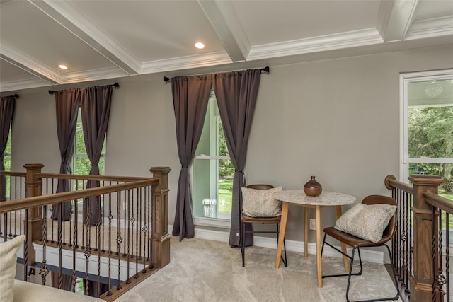 carpeted bedroom featuring beam ceiling, crown molding, and a crib