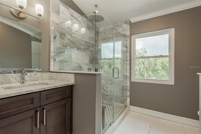 bathroom with tile patterned flooring, a shower with shower door, crown molding, and vanity