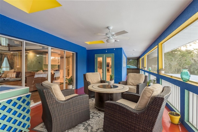 sunroom / solarium with ceiling fan