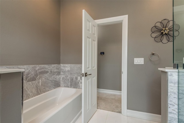 bathroom featuring tile patterned flooring and a bathtub