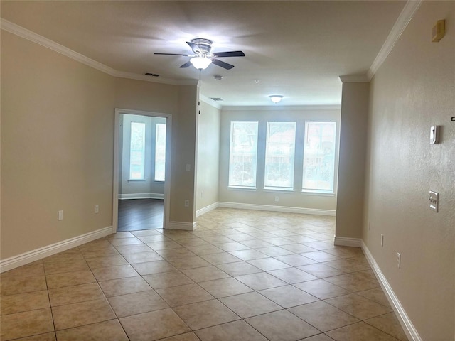 unfurnished room with ornamental molding, light tile patterned floors, and ceiling fan