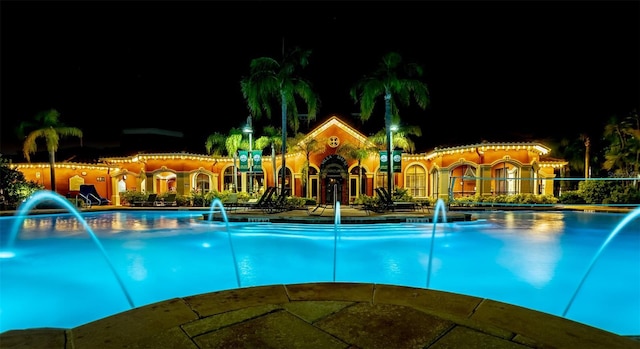 pool at twilight with pool water feature