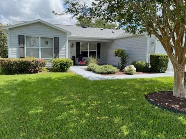 ranch-style home featuring a front yard