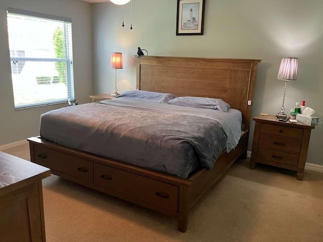 bedroom featuring light carpet