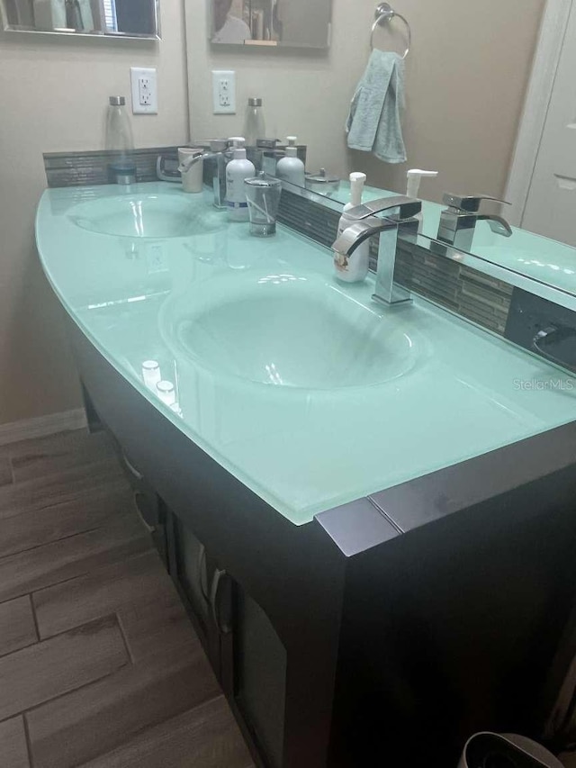 bathroom featuring vanity and wood-type flooring