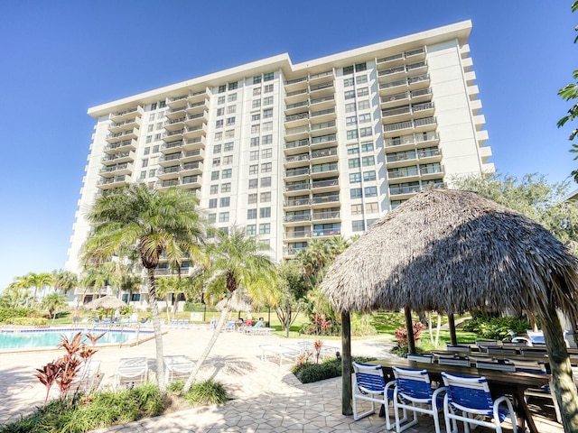 view of building exterior with a community pool