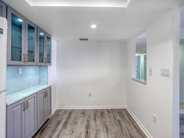 unfurnished dining area with light wood-type flooring