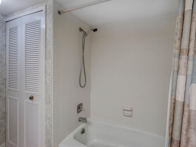 bathroom with shower / bathtub combination with curtain