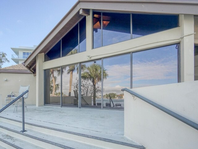 doorway to property with a patio area