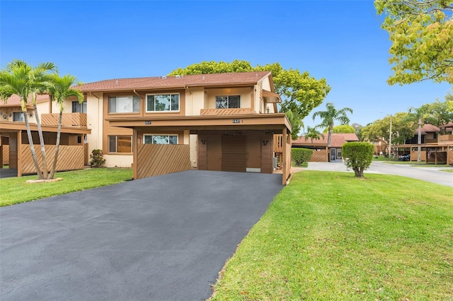 view of front of house with a garage and a front yard