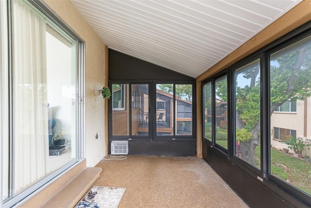 unfurnished sunroom with lofted ceiling and a healthy amount of sunlight