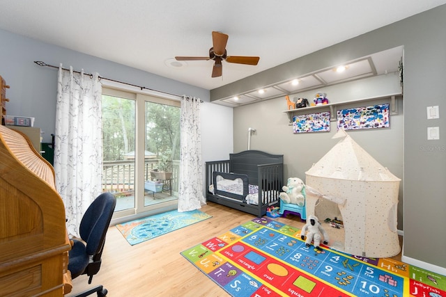 office with wood-type flooring and ceiling fan