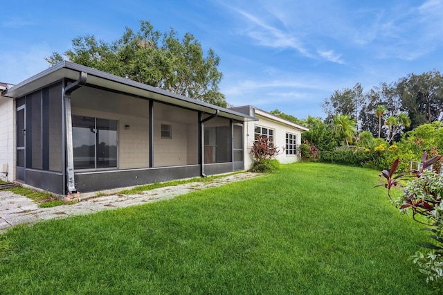 view of yard with a sunroom