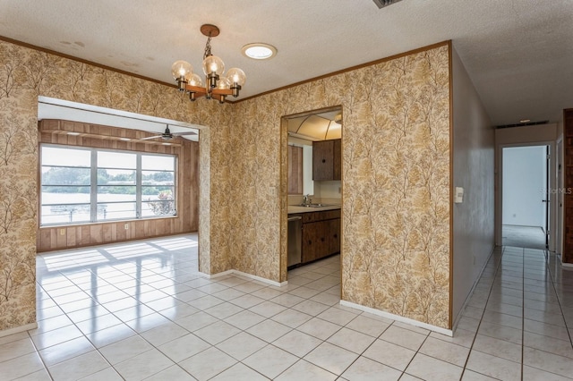 interior space featuring light tile patterned floors, a textured ceiling, and crown molding