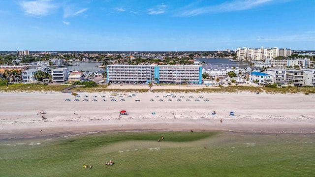 drone / aerial view with a water view and a view of the beach