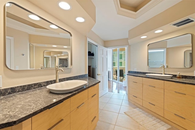 bathroom with vanity, tile patterned floors, and crown molding