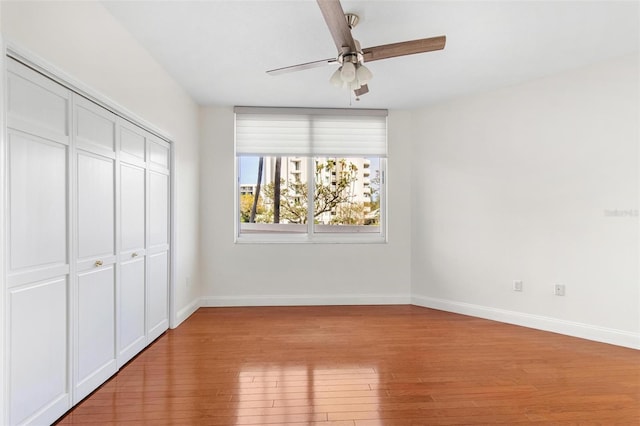 unfurnished bedroom featuring a closet, ceiling fan, and light hardwood / wood-style flooring