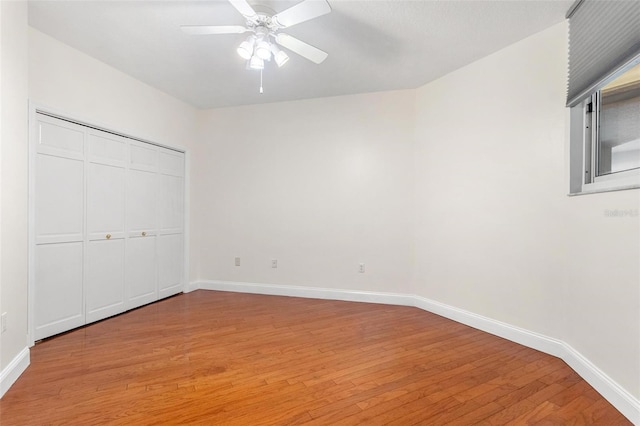 unfurnished bedroom featuring ceiling fan and light wood-type flooring