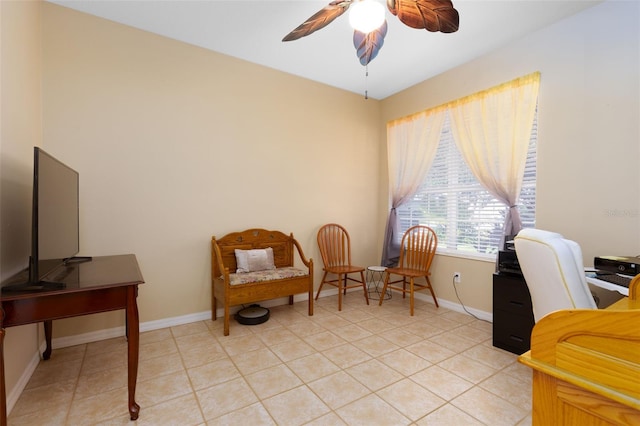 office featuring light tile patterned floors and ceiling fan