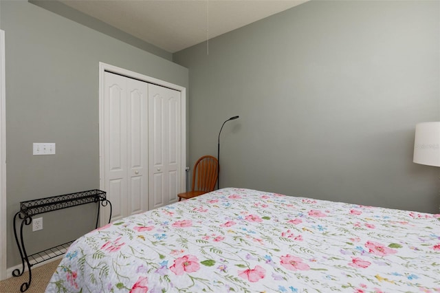 bedroom with carpet and a closet