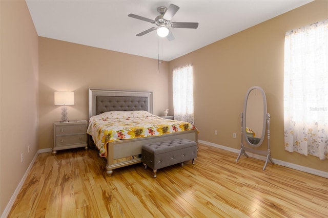 bedroom with light wood-type flooring and ceiling fan