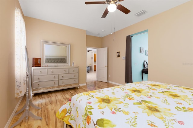 bedroom with light hardwood / wood-style flooring and ceiling fan