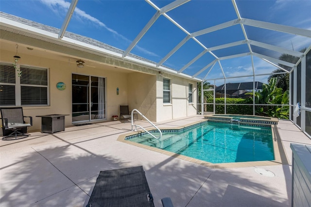 view of pool featuring a patio area, a lanai, and ceiling fan