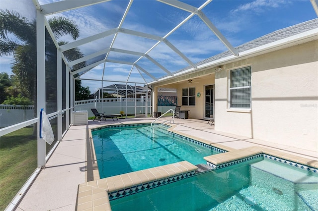 view of swimming pool featuring a patio, a lanai, and a yard