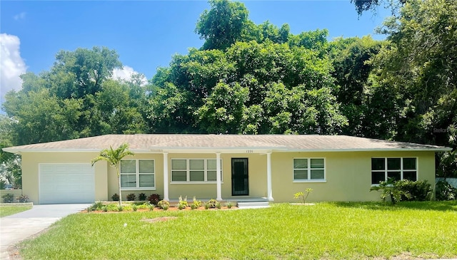 single story home with a garage and a front yard