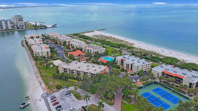 drone / aerial view with a beach view and a water view