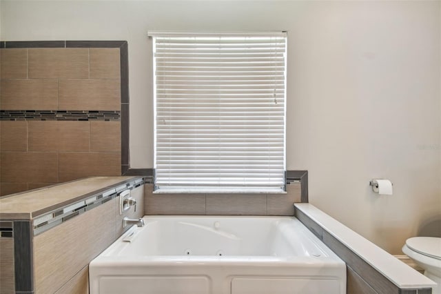 bathroom with toilet and a tub to relax in