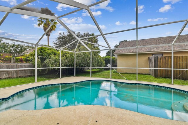 view of pool featuring a lanai