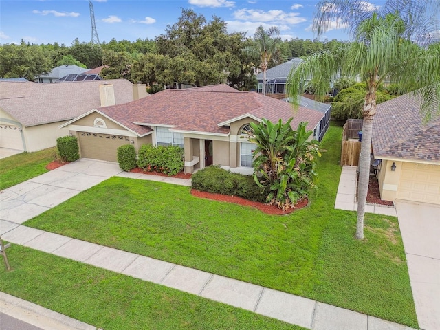 ranch-style home with a garage and a front yard