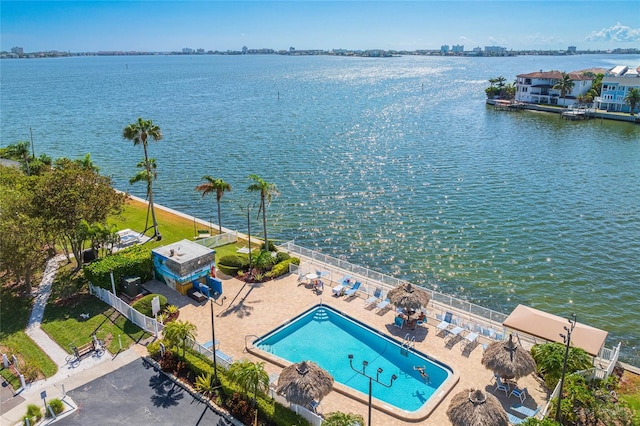 birds eye view of property with a water view