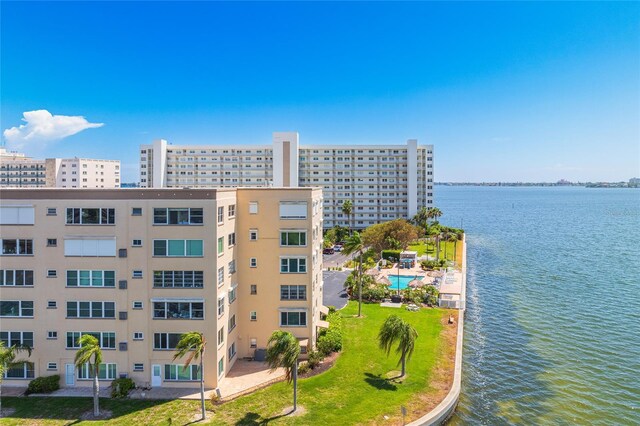 view of property with a view of city and a water view