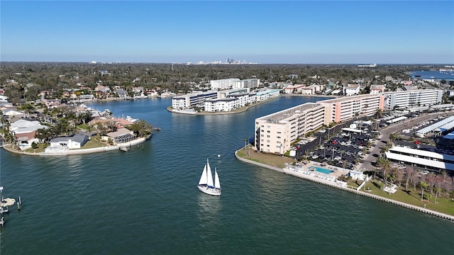 birds eye view of property featuring a city view and a water view