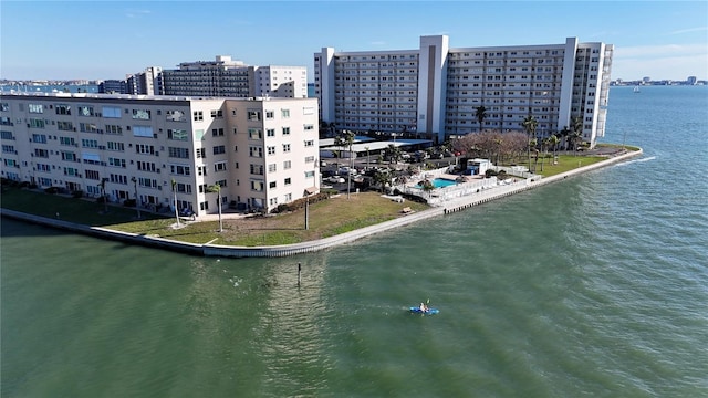 bird's eye view featuring a water view and a city view