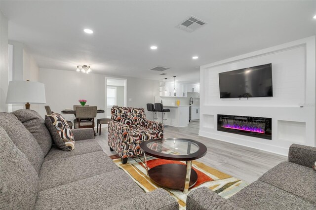 living room with light hardwood / wood-style flooring