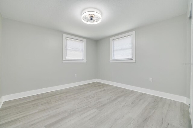 unfurnished room featuring light hardwood / wood-style floors