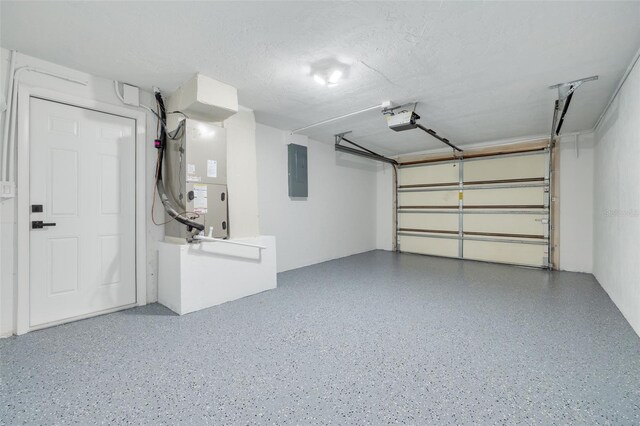 garage featuring a garage door opener and electric panel