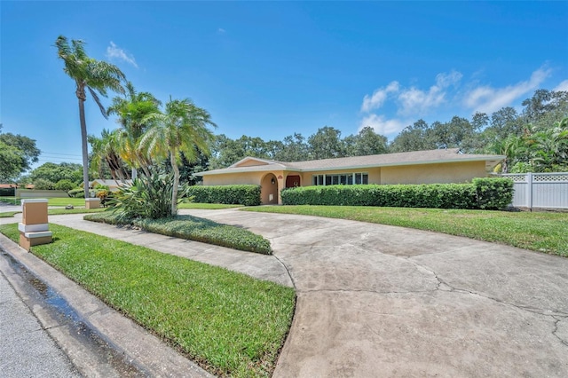 single story home featuring a front yard